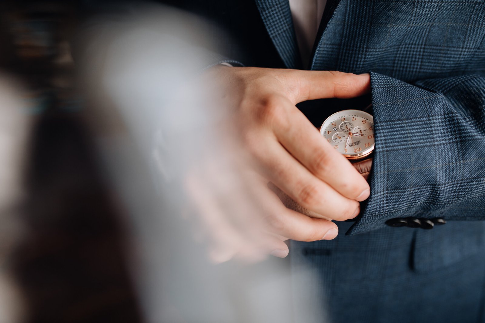 Man looks at a watch on his hand